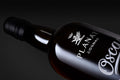 OSCAR Planat Cognac — détail bouteille sérigraphiée sur fond noir