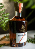 Planat Cognac VSOP Virgin Oak — bouteille présentée en décor végétal